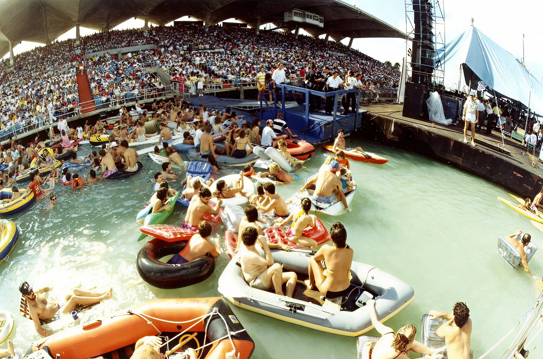 Concert at Marine Stadium with crowds on inflatable rafts